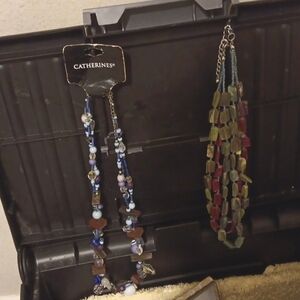 Necklaces and a butterfly brooch